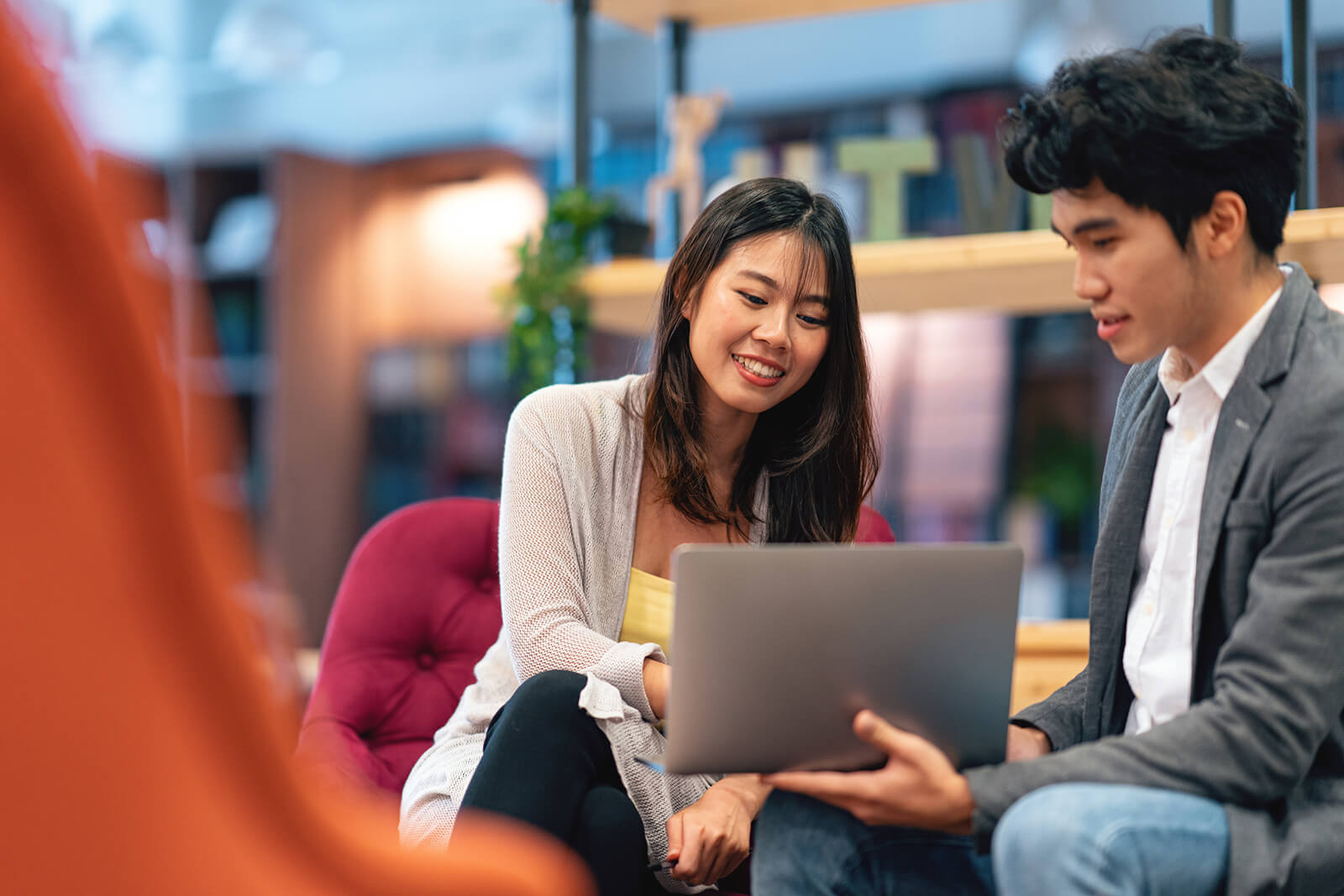 Couple looking at a laptop